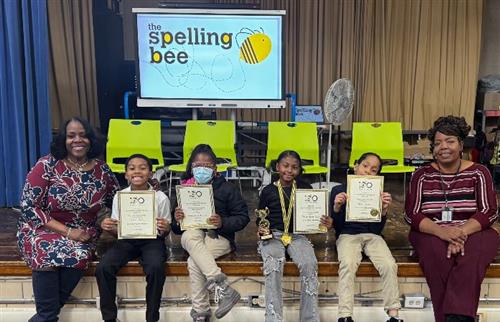 students posing with certificates